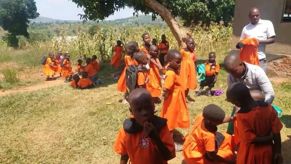 Children in class receiving free academic education support in Uganda